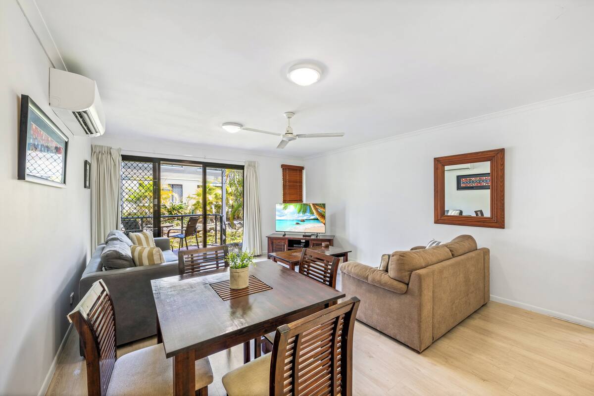 One Bedroom Apartment | Living area | 65-inch TV with cable channels, DVD player