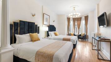 Standard fyrbÀddsrum - 2 queensize-sÀngar | Ljudisolering, strykjÀrn/strykbrÀda, gratis wi-fi och sÀngklÀder