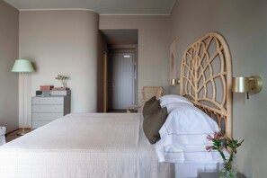 Deluxe Double Room, Sea View | Minibar, in-room safe, desk, blackout drapes - Is Molas Resort (Pula)