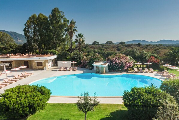 Seasonal outdoor pool, open 10:00 AM to 7:00 PM, pool umbrellas