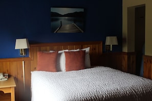 Economy Room, 1 Queen Bed | Blackout drapes, iron/ironing board, free WiFi, bed sheets
