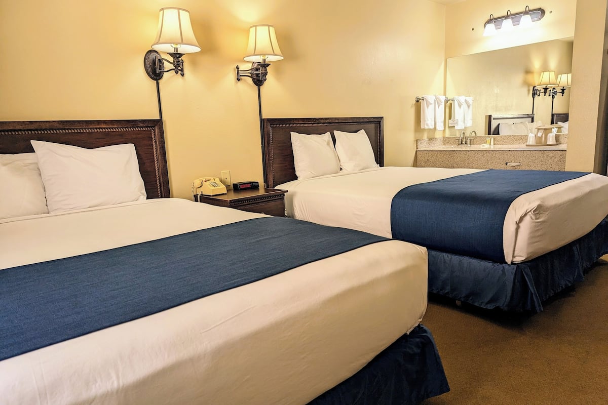 room, 2 queen beds | in-room safe, iron/ironing board, rollaway beds, free wifi
