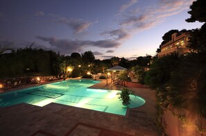 Outdoor pool, open 10:00 AM to 6:00 PM, pool umbrellas, pool loungers