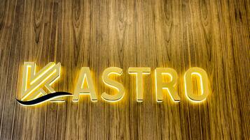 Illuminated letters spelling "ASTRO" on a wooden surface.