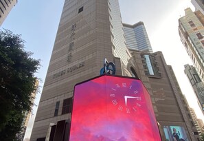 A tall building with a clock on top and a sign that reads "Times Square." - Holiday Inn Express Causeway Bay Hong Kong by IHG (Hong Kong)