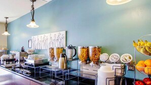 A breakfast bar with various food items and amenities. - Sleep Inn & Suites Evansville - Casper (Evansville)