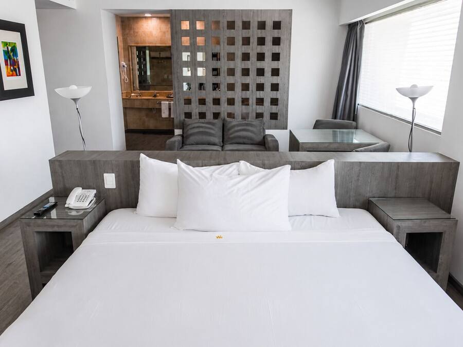 Master Suite with jacuzzi and street view | In-room safe, laptop workspace, blackout drapes, soundproofing