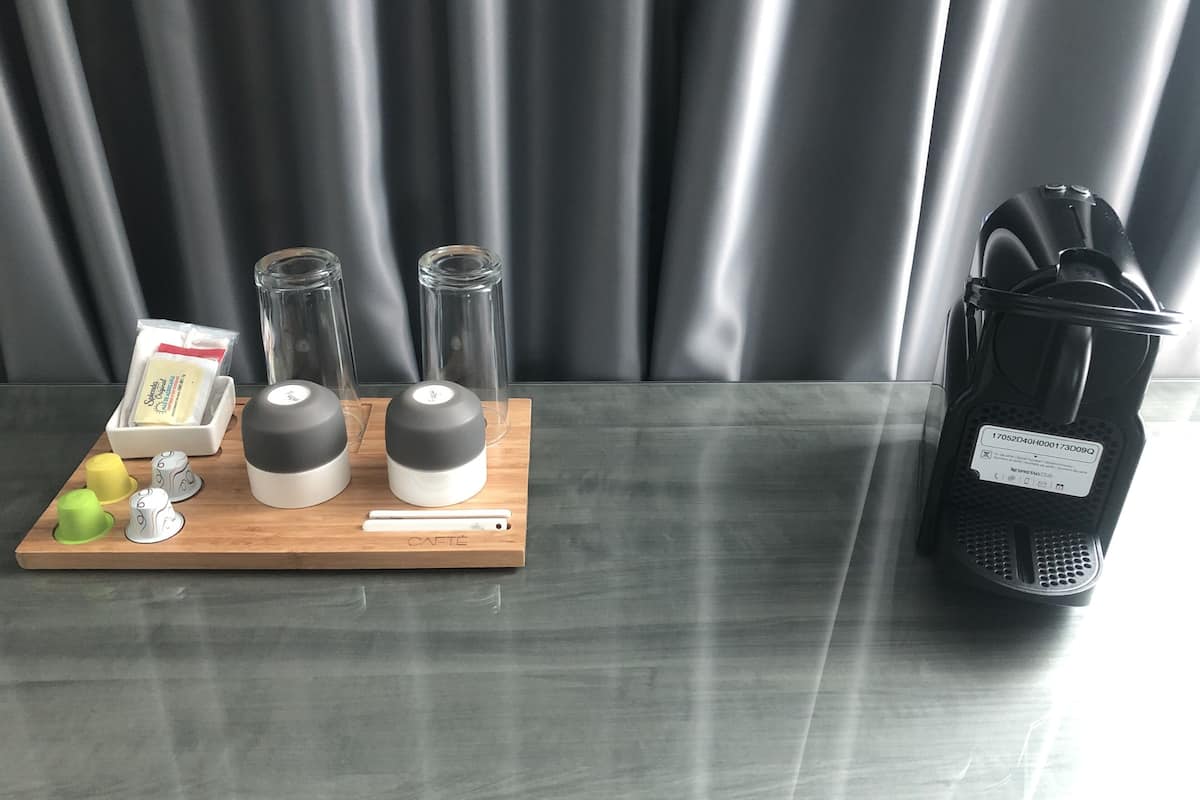 business suite with living area and street view | coffee and/or coffee maker