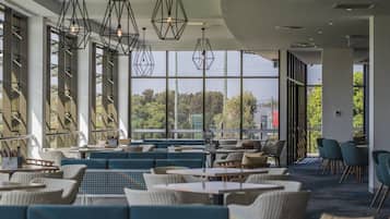 Lunch, dinner served; local cuisine, golf course views