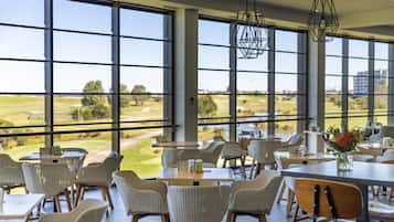 Lunch, dinner served; local cuisine, golf course views