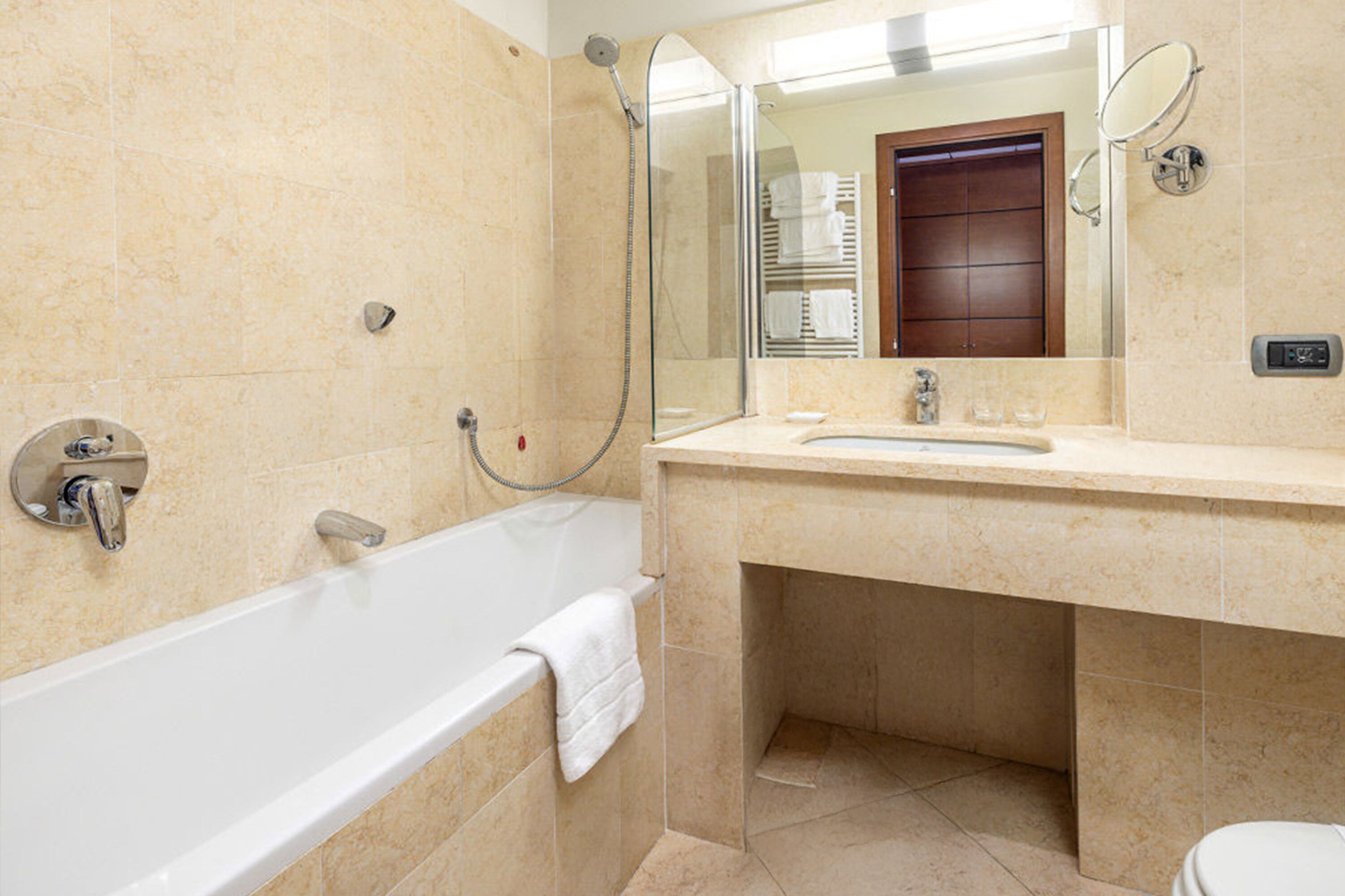 designer toiletries, hair dryer, slippers, bidet