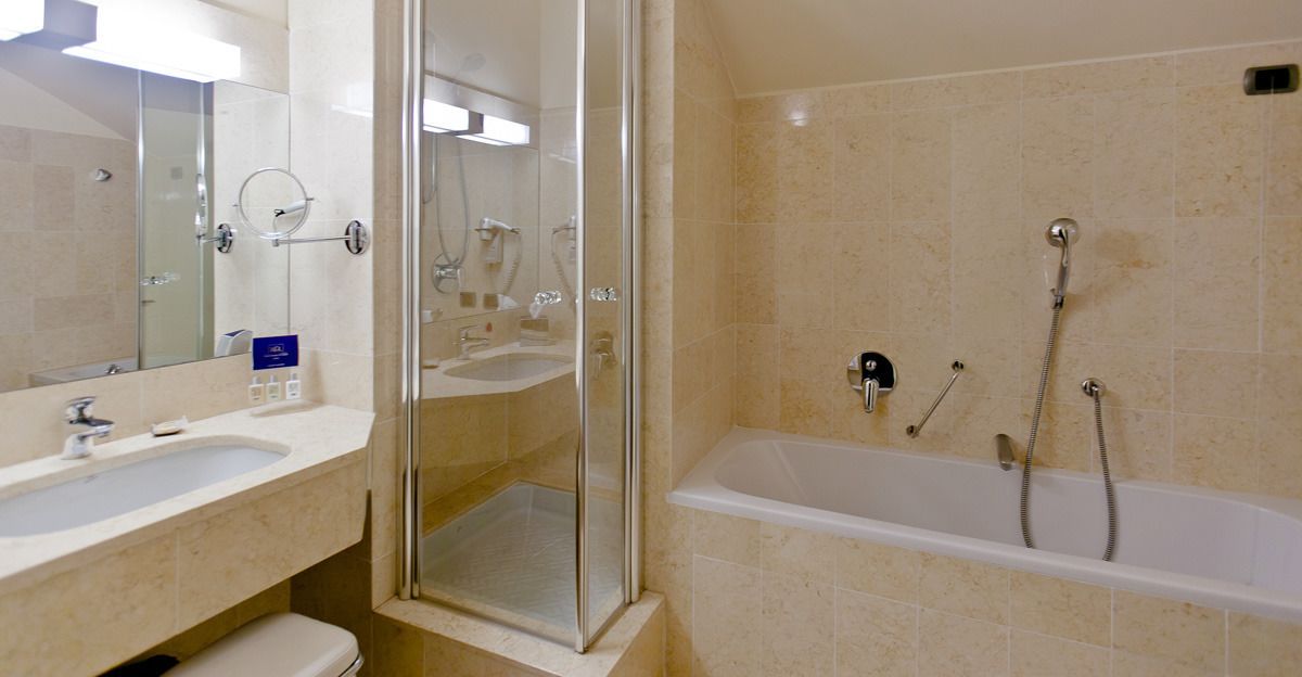 designer toiletries, hair dryer, slippers, bidet