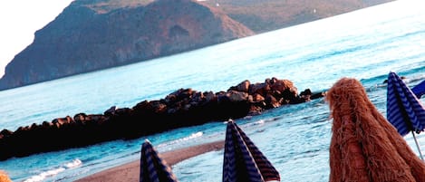 On the beach, sun-loungers