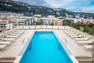 Seasonal outdoor pool, open 9:30 AM to 6 PM, sun loungers