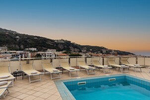 Seasonal outdoor pool, open 9:30 AM to 6 PM, sun loungers