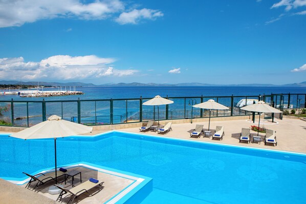 Seasonal outdoor pool, open 10 AM to 6:30 PM, pool umbrellas