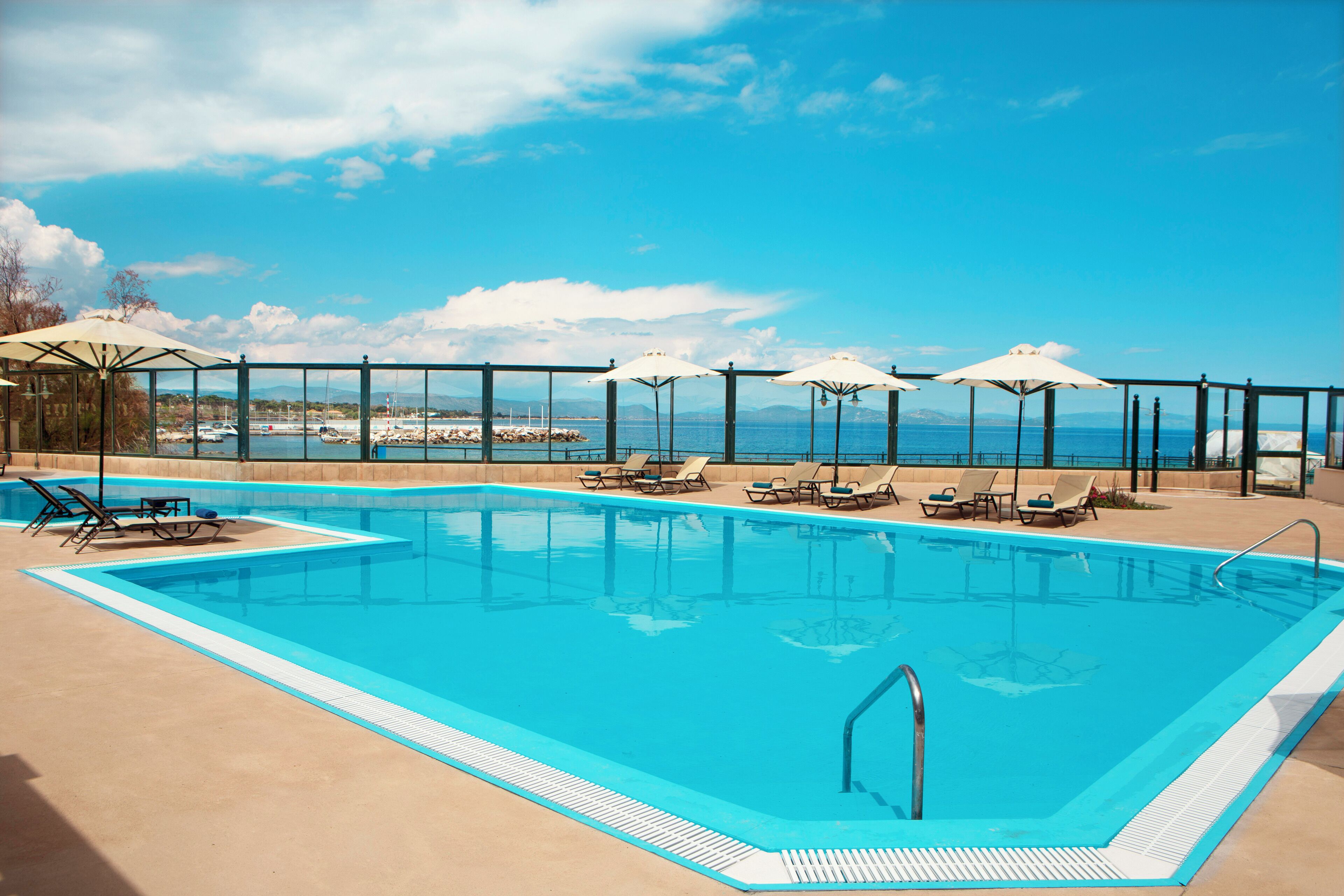 Seasonal outdoor pool, open 10 AM to 6:30 PM, pool umbrellas