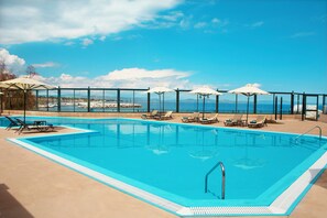 Seasonal outdoor pool, open 10 AM to 6:30 PM, pool umbrellas - Zeus Essence Ramada by Wyndham Athens (Marathon)