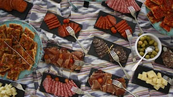 A table with various food items and utensils.
