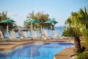 Outdoor pool, open 10:00 AM to 6:00 PM, pool umbrellas, sun loungers