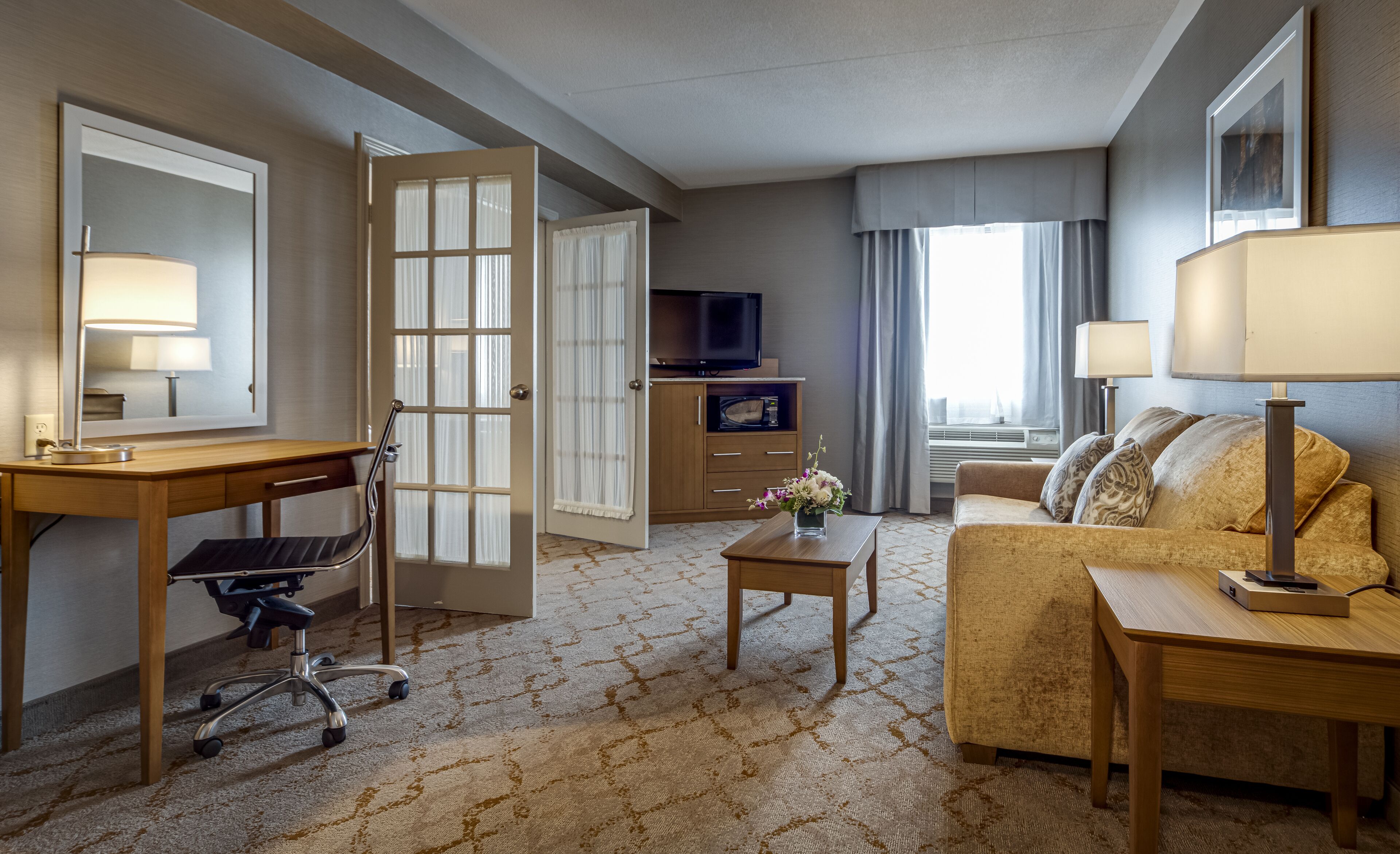 deluxe queen suite with jetted tub-separate living room | living room | 37-inch lcd tv with cable channels, tv, pay films