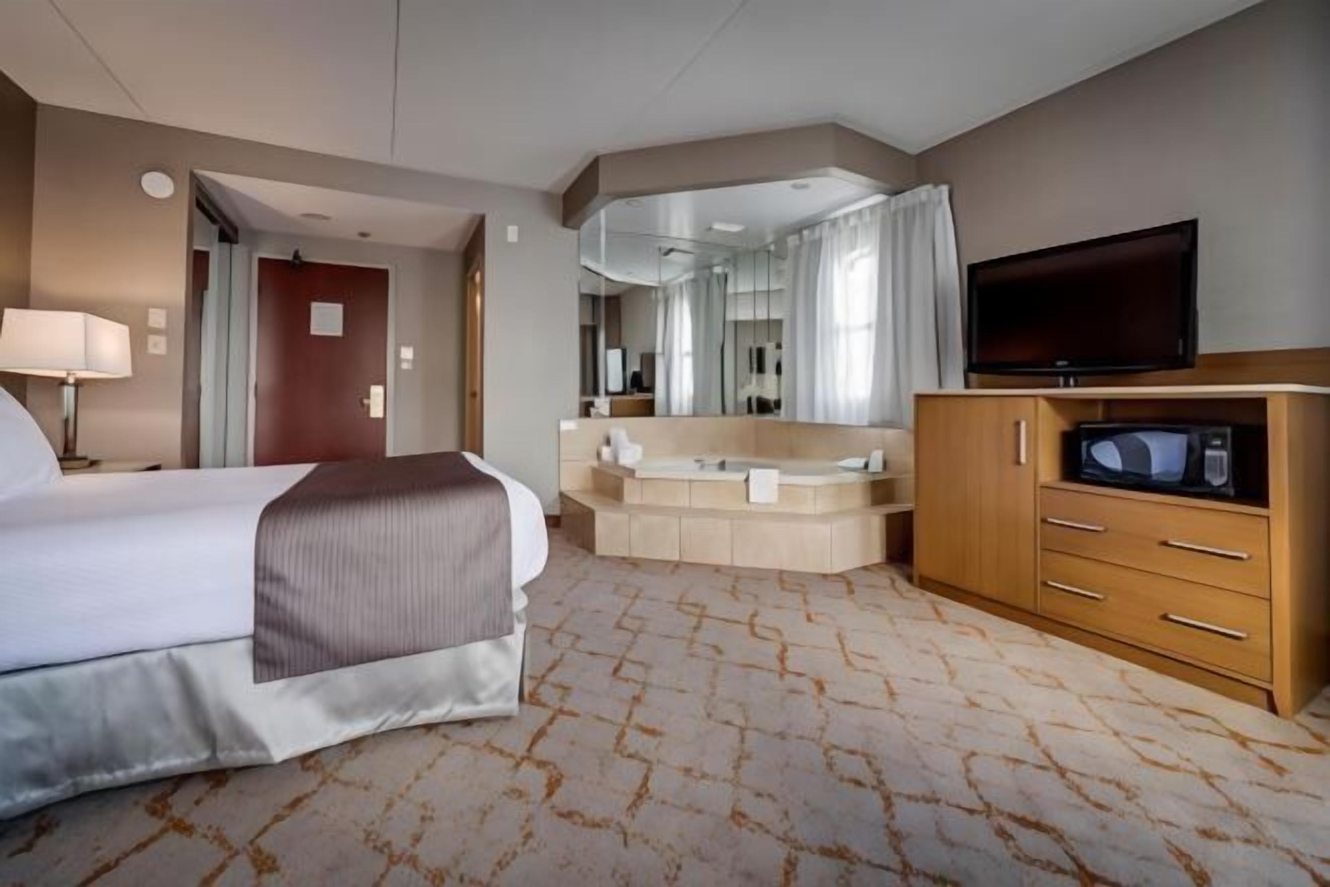 Premium bedding, down duvets, pillow-top beds, in-room safe