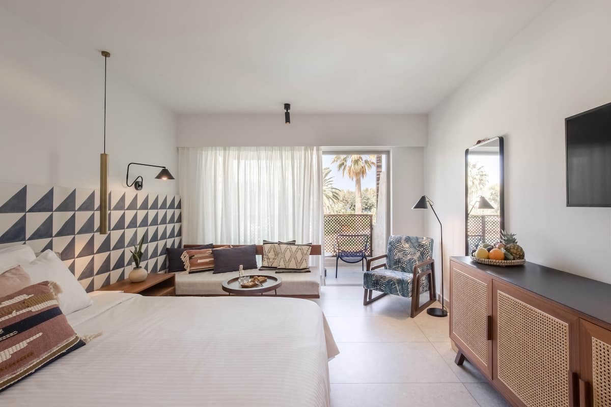 Bungalow, Pool View | Minibar, in-room safe, individually decorated, desk