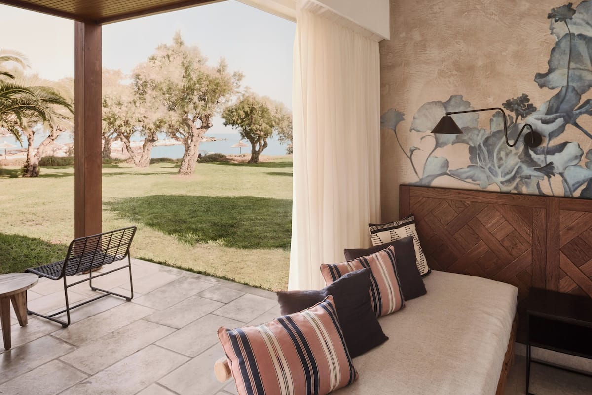 Bungalow (Beach Front) | Minibar, in-room safe, individually decorated, desk
