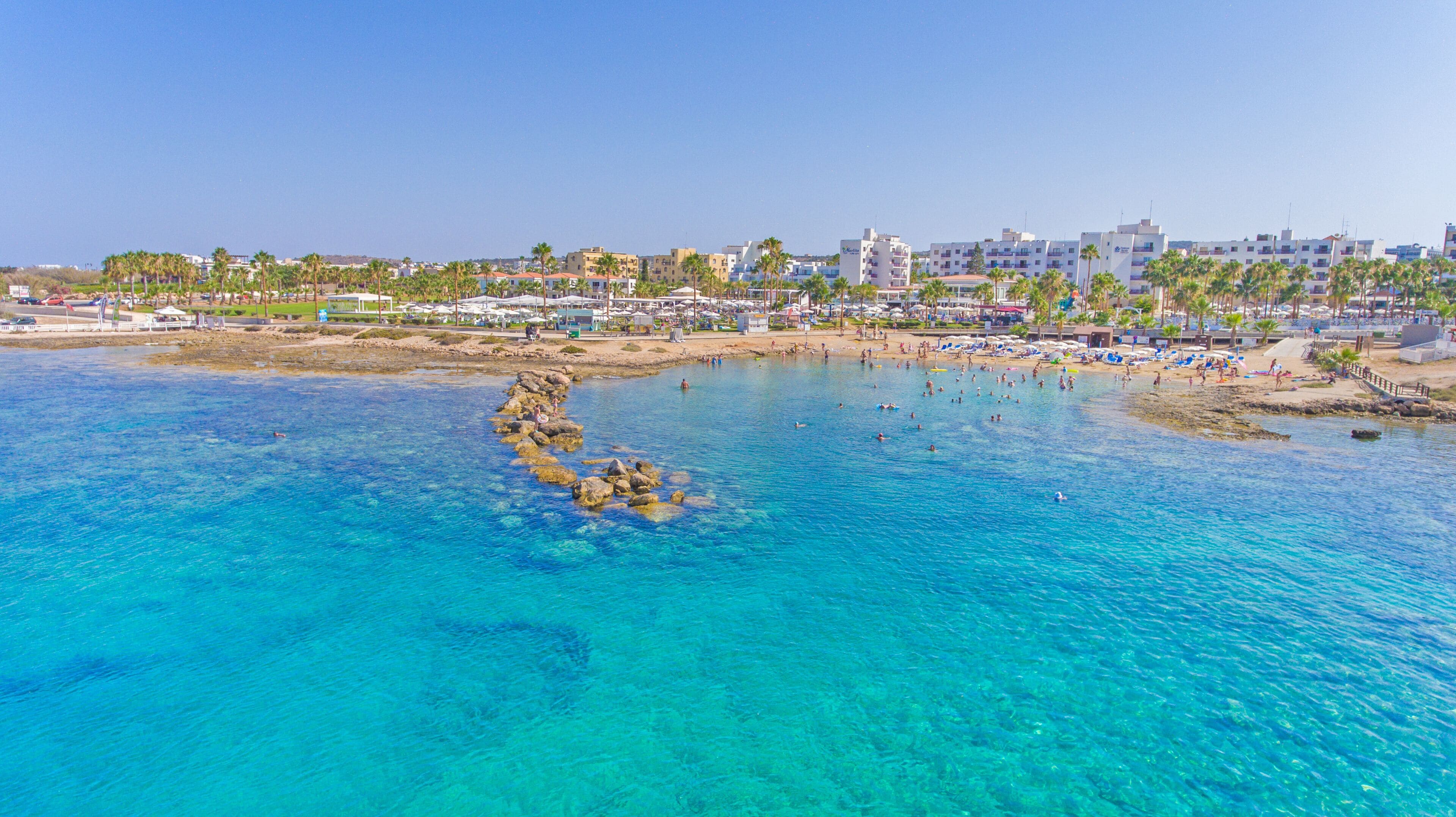 White sand, sun loungers, beach umbrellas, beach towels