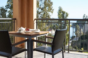 Enjoy a romantic breakfast for two on the balcony overlooking the serene water views.