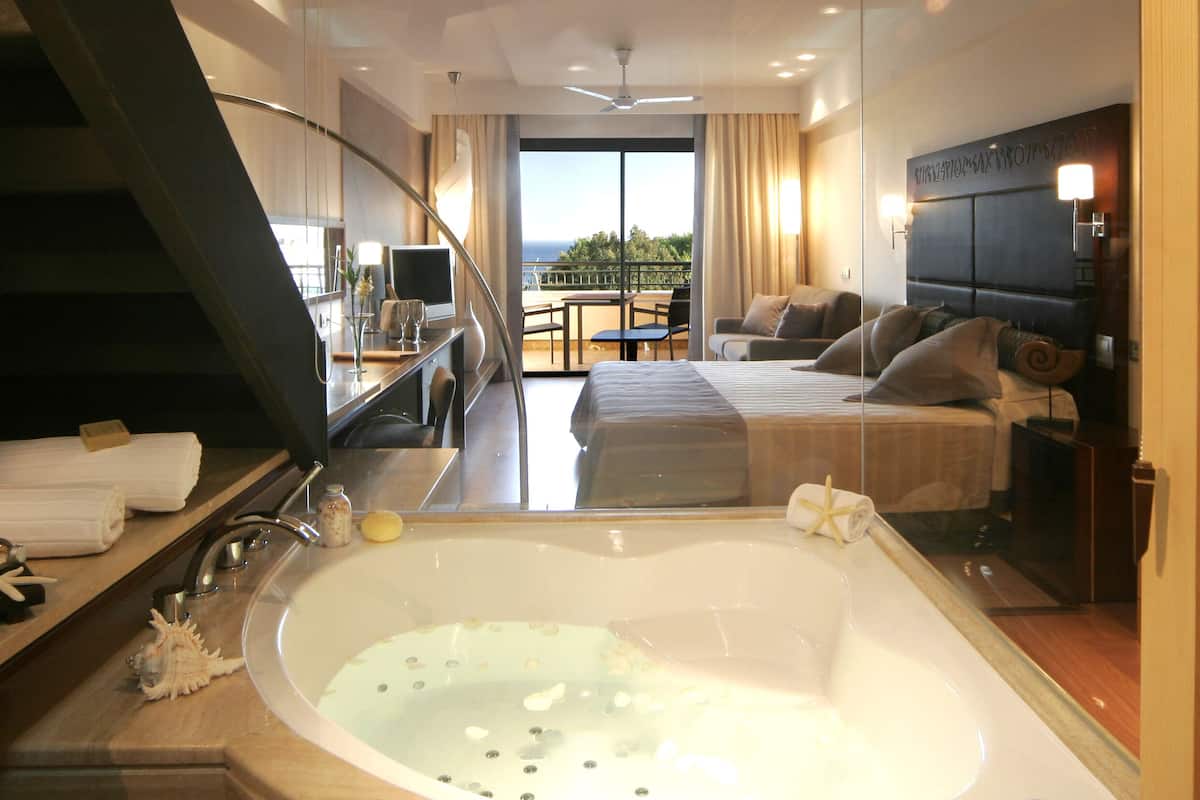 junior suite, jetted tub (prestige solarium) | bathroom | combined shower/bathtub, deep-soaking bathtub, designer toiletries