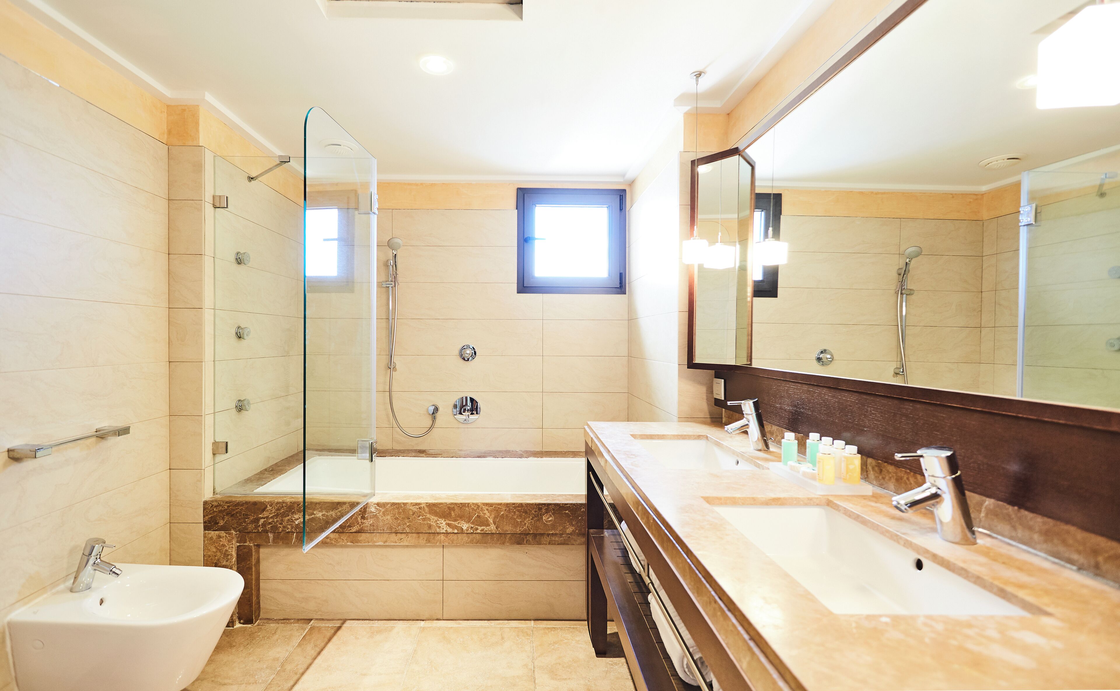 combined shower/bathtub, deep-soaking bathtub, designer toiletries