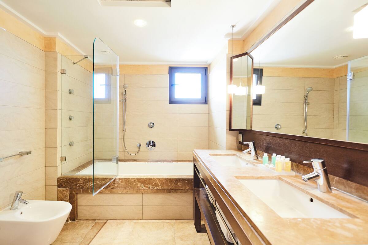 combined shower/bathtub, deep-soaking bathtub, designer toiletries