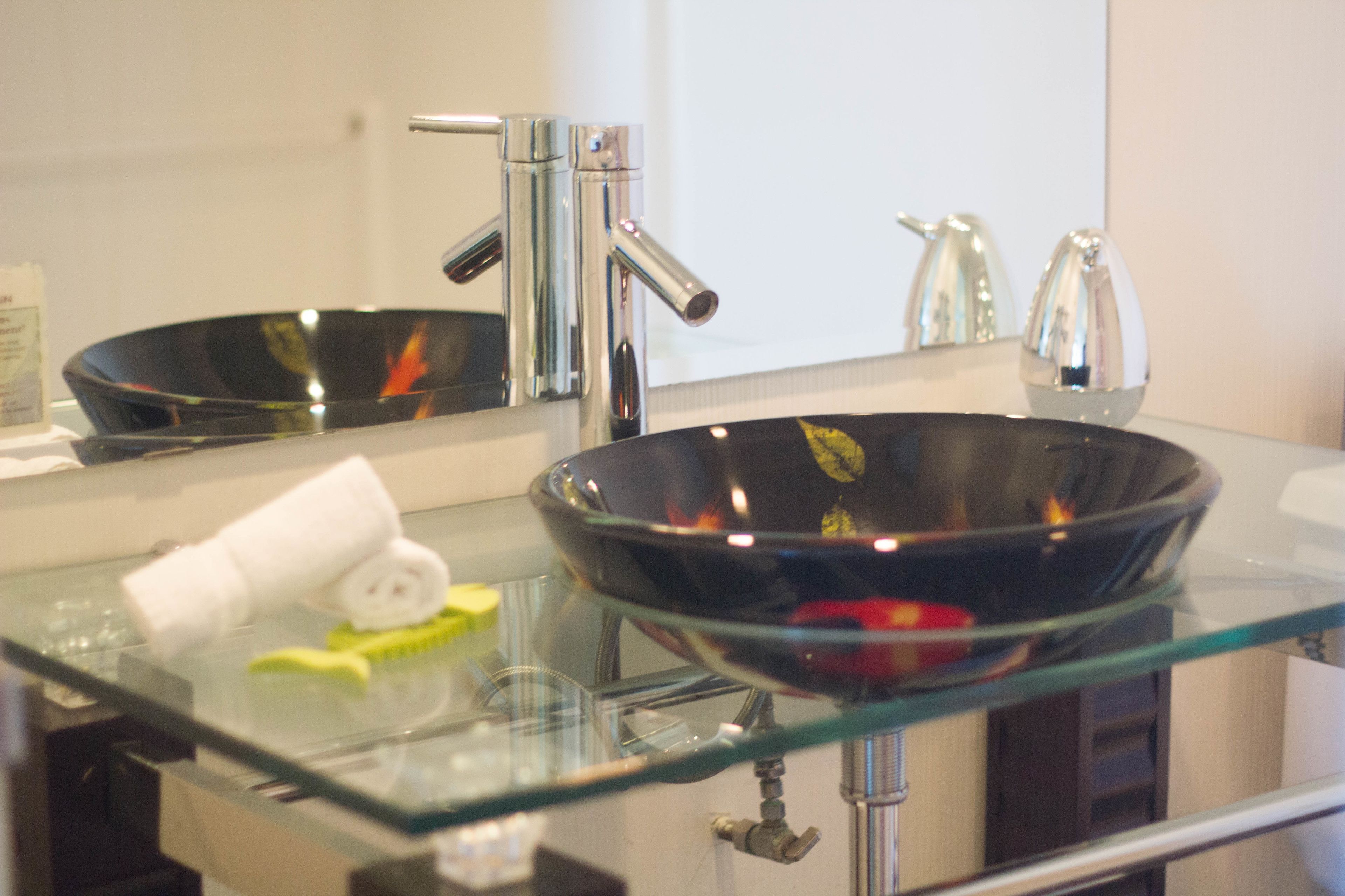 combined shower/bathtub, designer toiletries, hair dryer, towels