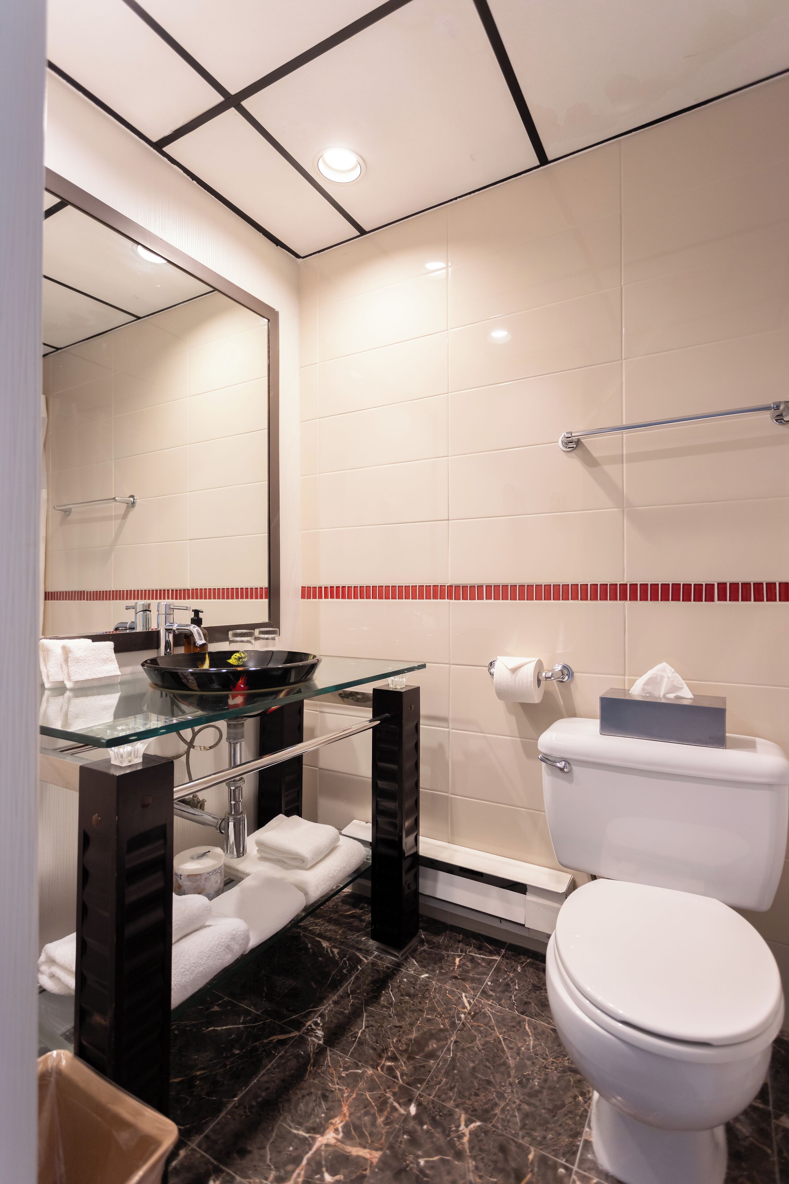 combined shower/bathtub, designer toiletries, hair dryer, towels