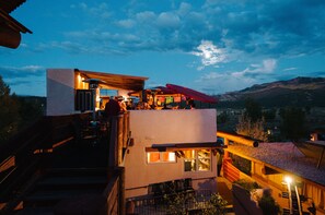 Experience the rooftop terrace with outdoor seating and scenic views.