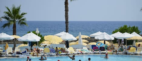 Indoor pool, seasonal outdoor pool, pool umbrellas, sun loungers
