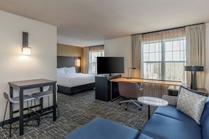 Premium bedding, desk, laptop workspace, blackout curtains