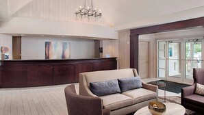 A modern lobby with a reception desk, a sofa, and a coffee table. - Residence Inn by Marriott Worcester (Worcester)