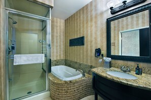 Extended Stay Balcony King Suite Kitchenette | Bathroom | Separate bathtub and shower, deep-soaking bathtub, free toiletries