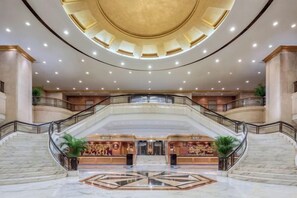 A spacious lobby with a grand staircase, marble flooring, and a central reception area. - Changsha Jinyuan Yangguang Hotel (Wu Yi Square Helong Stadium) (Changsha)