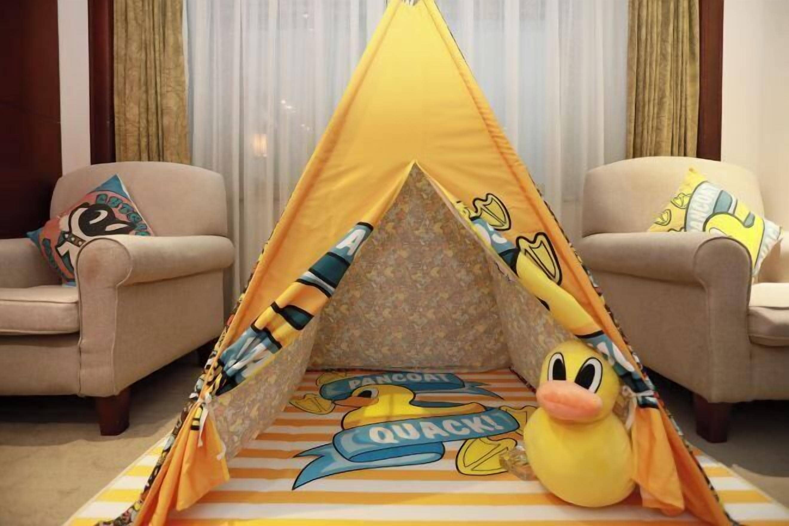 A tent with cartoon duck characters and the words "Pancake" and "Quack!" on the floor.