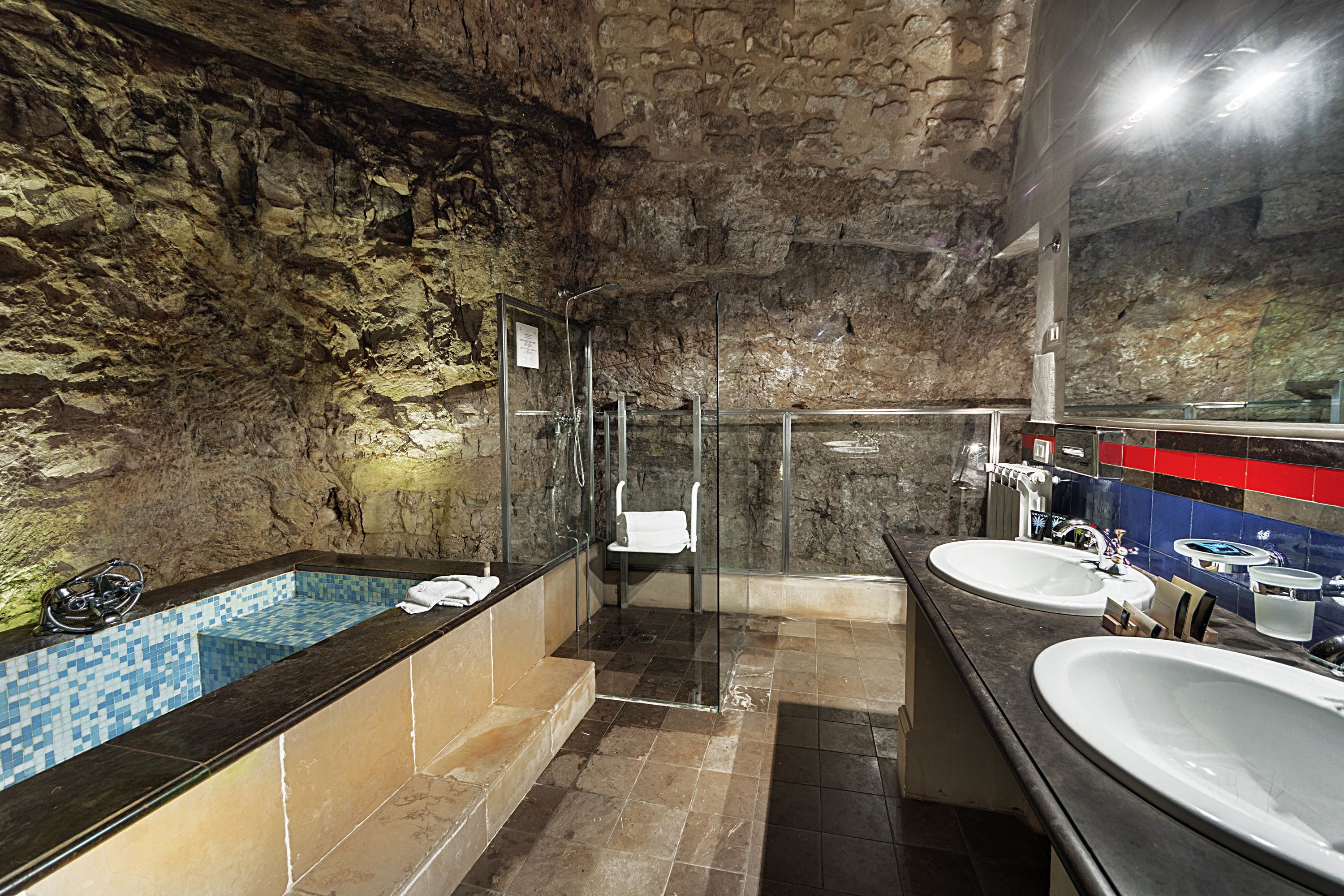 deluxe junior suite | bathroom | designer toiletries, hair dryer, bathrobes, slippers