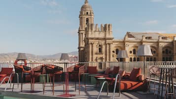 Outdoor pool, open 10 AM to 8 PM, pool umbrellas, pool loungers