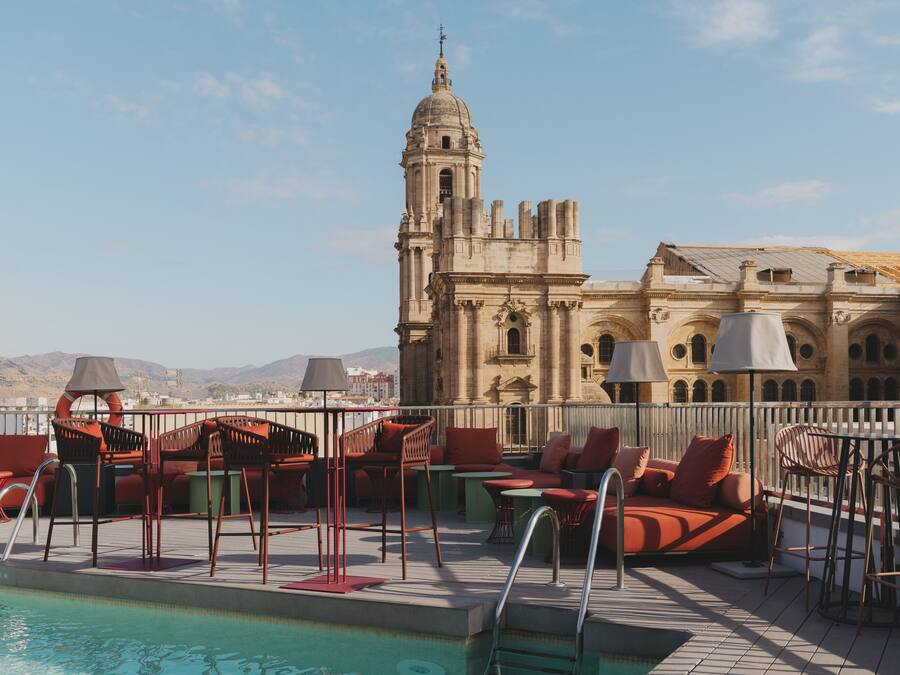 Outdoor pool, open 10 AM to 8 PM, pool umbrellas, pool loungers