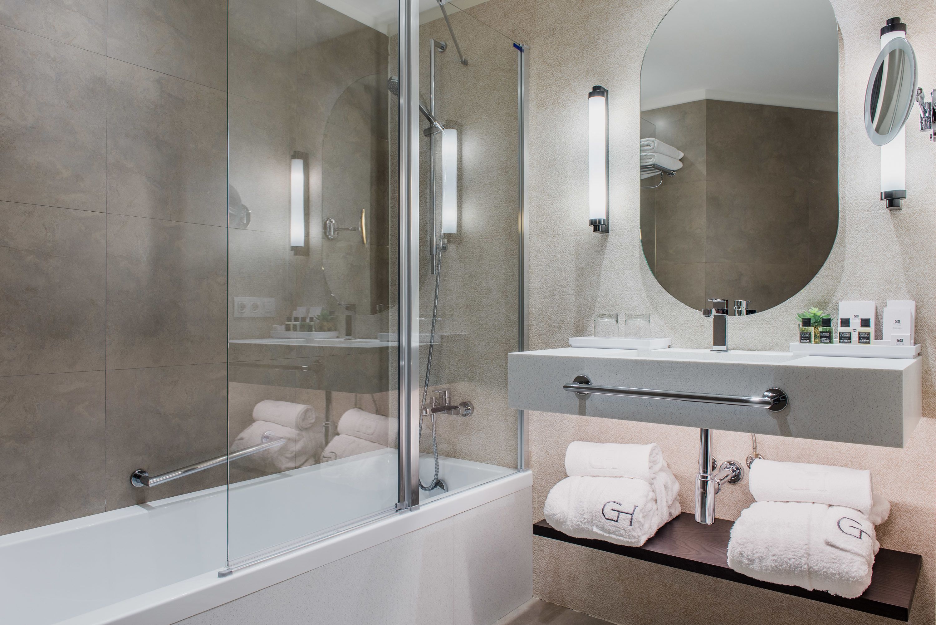 designer toiletries, hair dryer, slippers, bidet