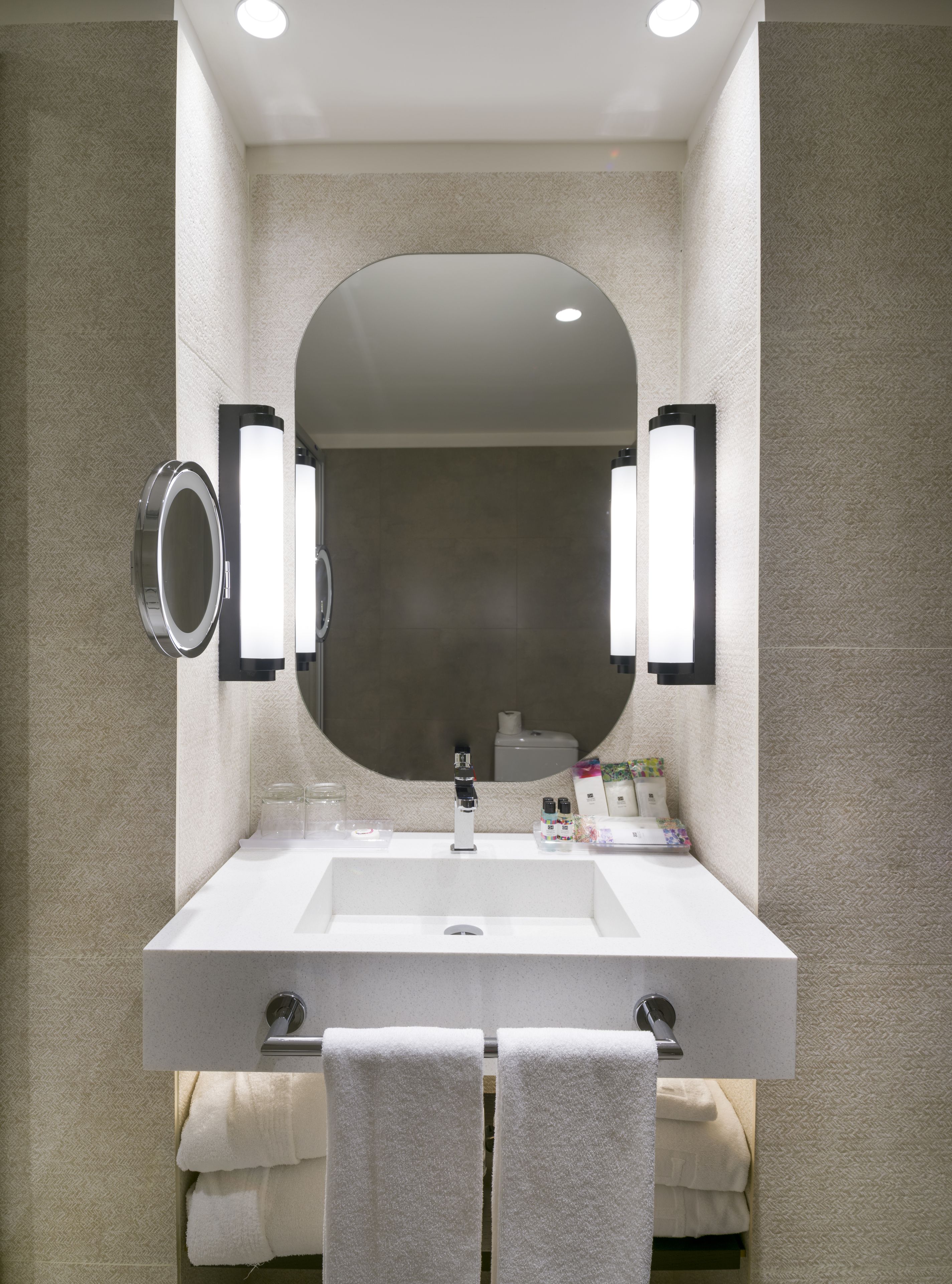 designer toiletries, hair dryer, slippers, bidet