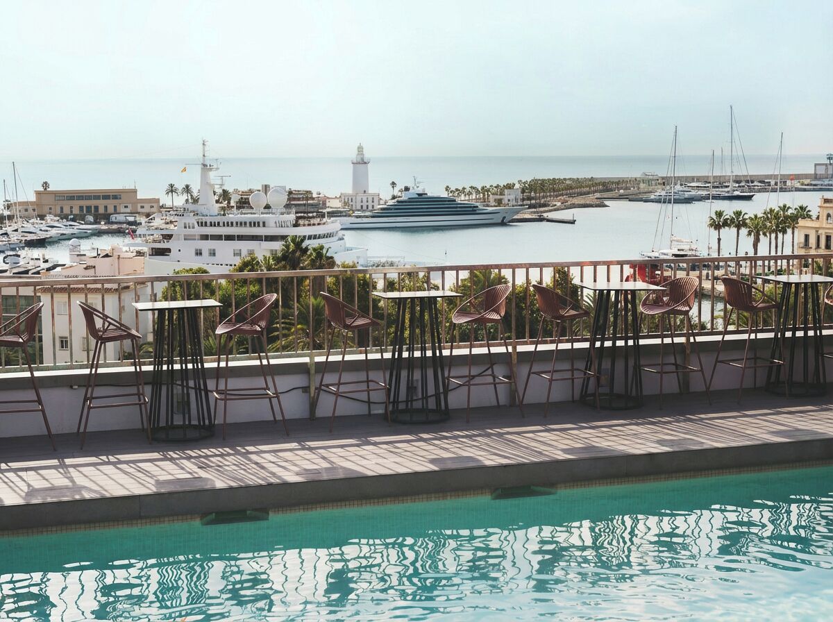 Outdoor pool, open 10 AM to 8 PM, pool umbrellas, pool loungers