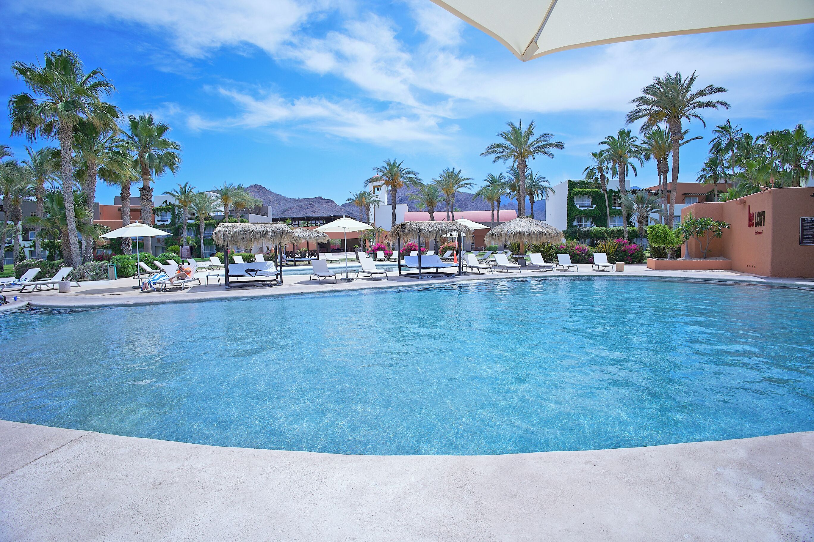 Outdoor pool, pool umbrellas, sun loungers