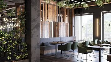 A modern interior with wooden accents, green plants, and a seating area with tables and chairs.
